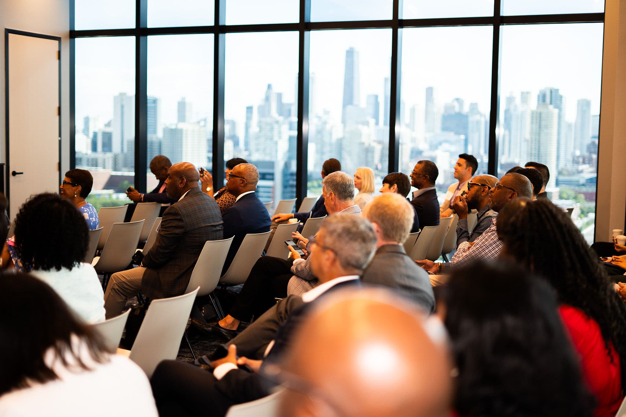 2Flo Ventures event audience with Chicago skyline